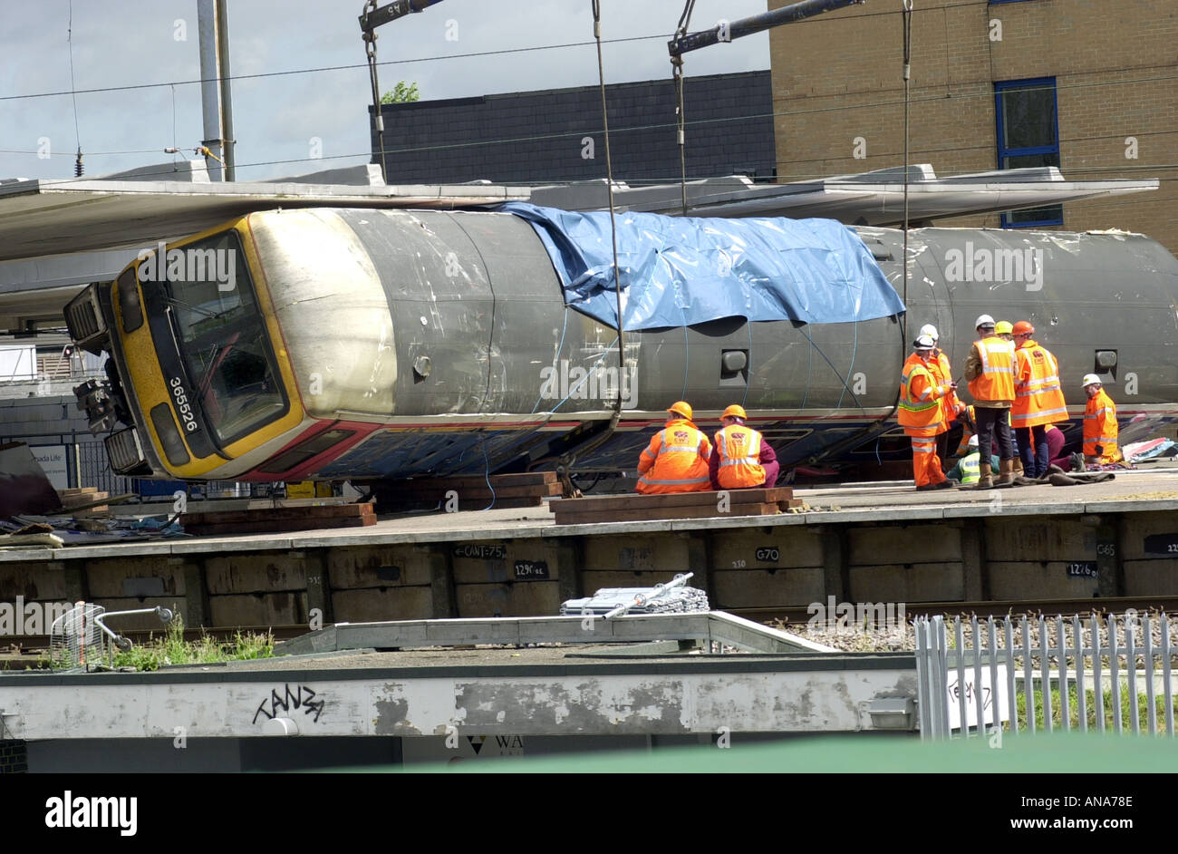 Engineers examine a carriage at the Potters Bar rail crash UK Stock