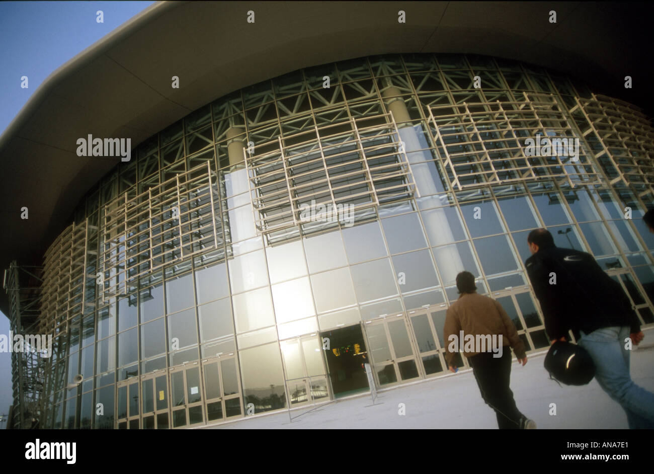 Spectators entering the completed Olympic Taekwondo stadium during the