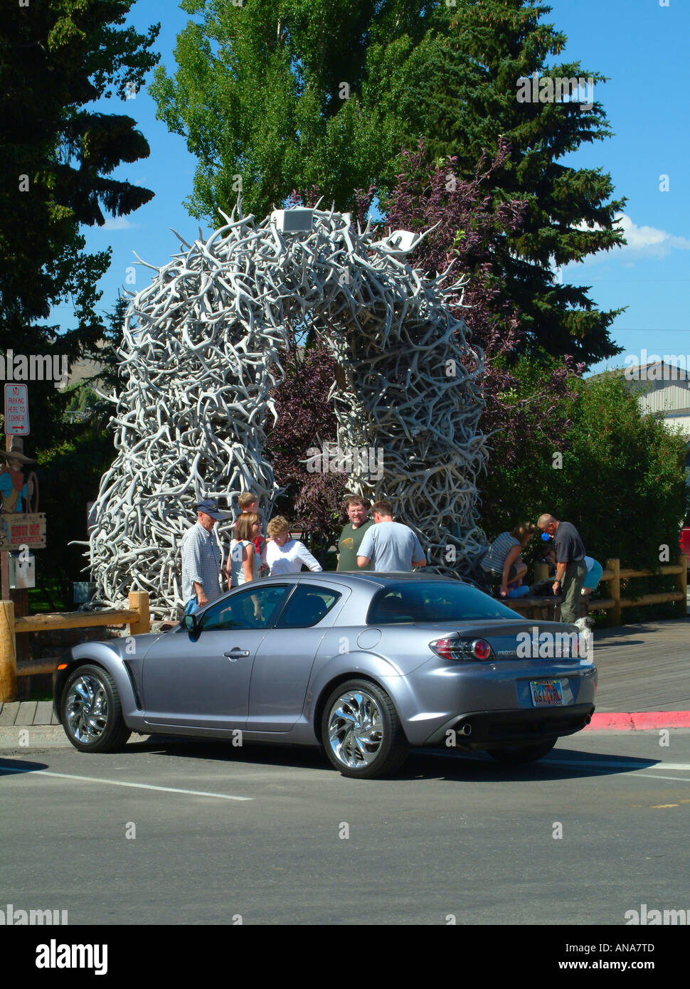 Mazda RX8 Sports Car Parked near Arch of Elk Antlers by Central Park in Jackson Wyoming USA Stock Photo
