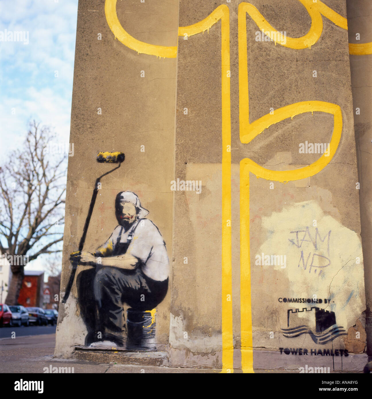 Banksy's double yellow lines of flower painting and painter with a roller on a wall in Bethnal Green, East London KATHY DEWITT Stock Photo