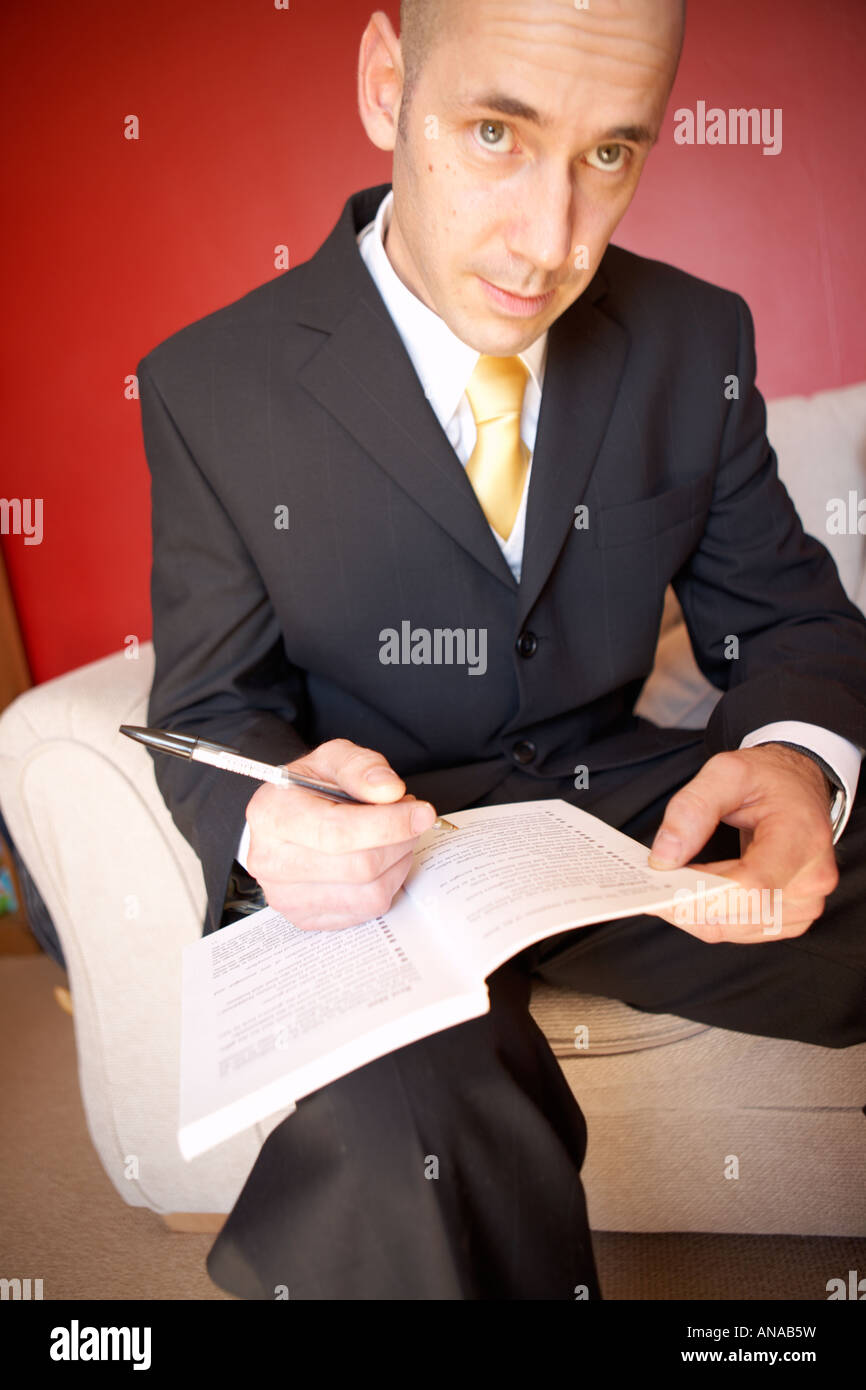 Nervous groom writing his speech moments before the wedding Stock Photo