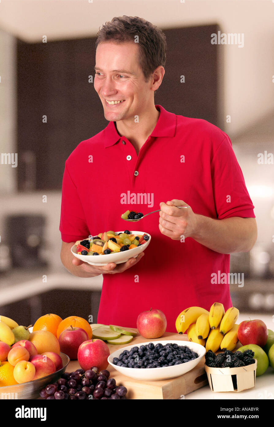 MAN EATING FRUIT SALAD Stock Photo Alamy