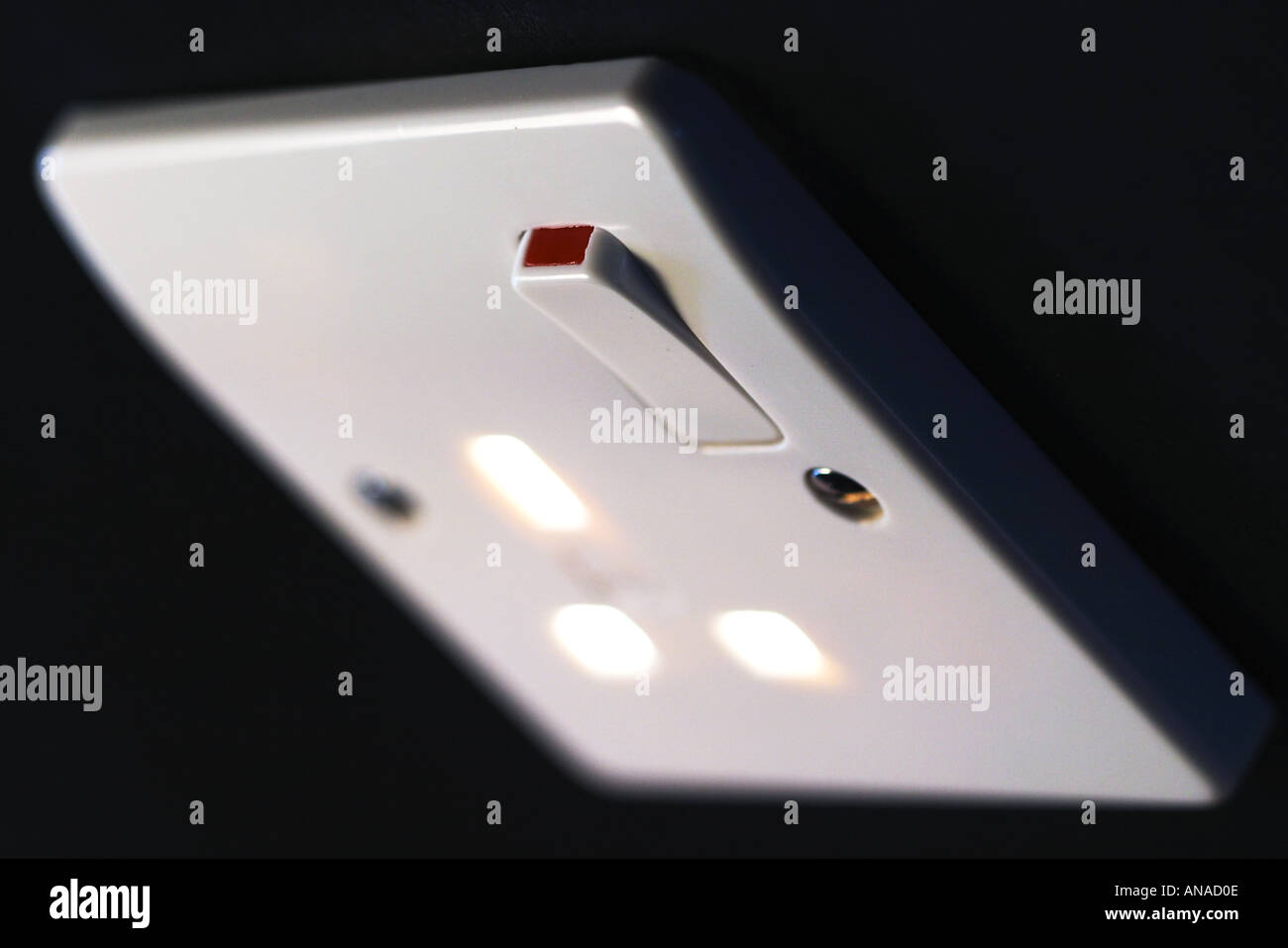 UK Electrical Power Outlet Light shining through like fire Stock Photo