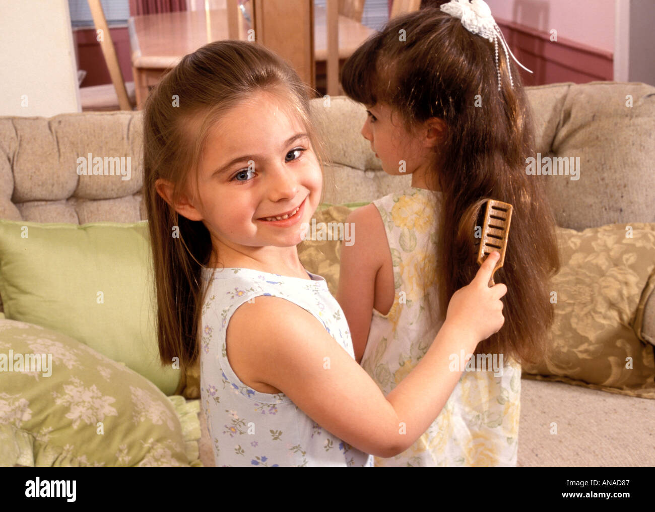 Girls doing hair Stock Photo Alamy