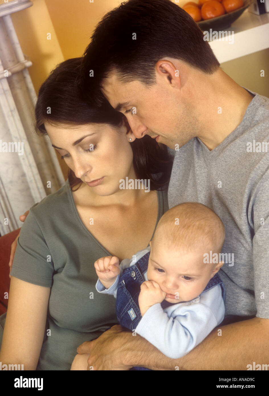 Mother with postnatal depression being comforted by her husband British English woman man - coronovirus covid-19 covid19, England, Britain, U.K. UK Stock Photo