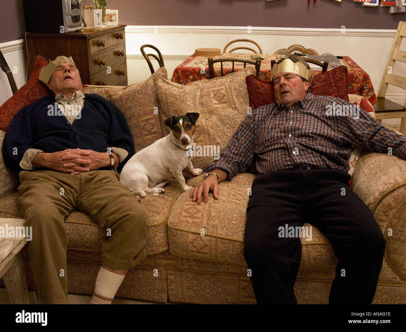 men napping after christmas dinner Stock Photo