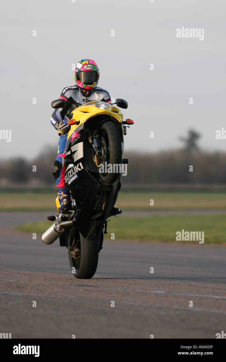 Motorcycles doing stunts including wheelies and jesus christs and burnouts Stock Photo