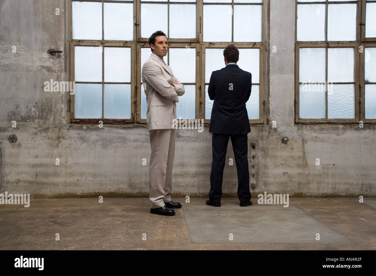 Two people standing in front of building hi-res stock photography and ...