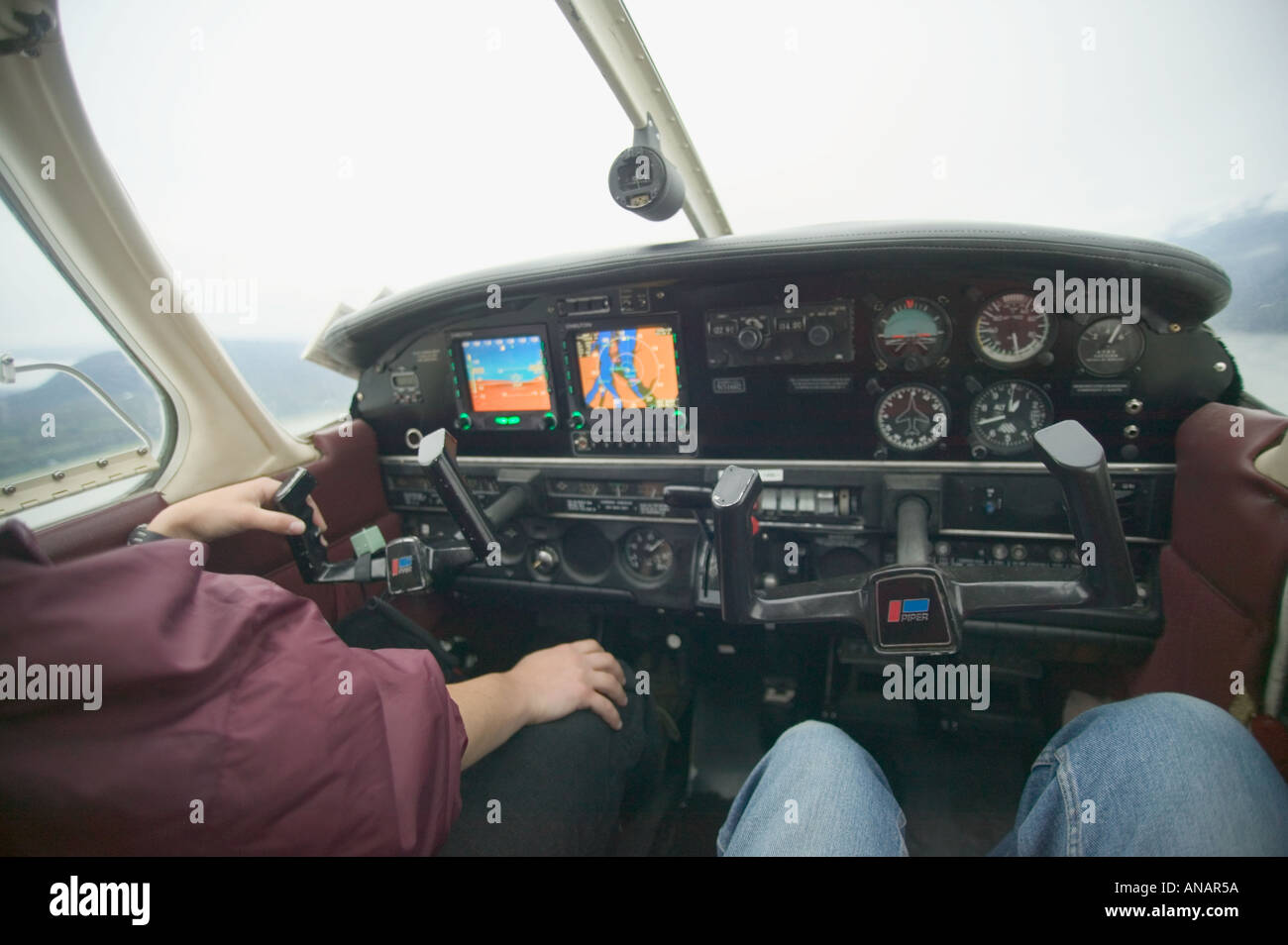Pilot At The Helm Of An Airplane Stock Photos & Pilot At The Helm ...