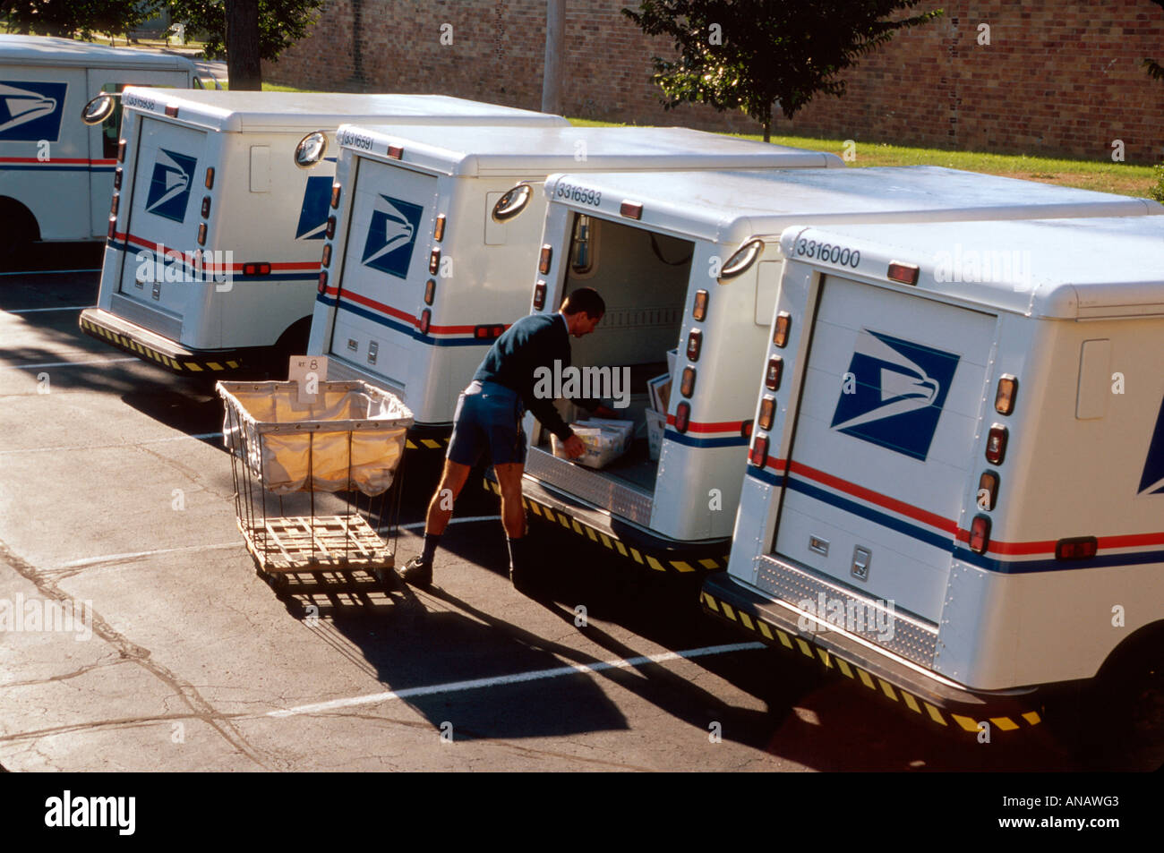 Ohio Oberlin,US Post Office,mail carrier,delivery,van,mailman,truck,lorry,letters,packages,working,work,employee employees worker workers staff,parkin Stock Photo