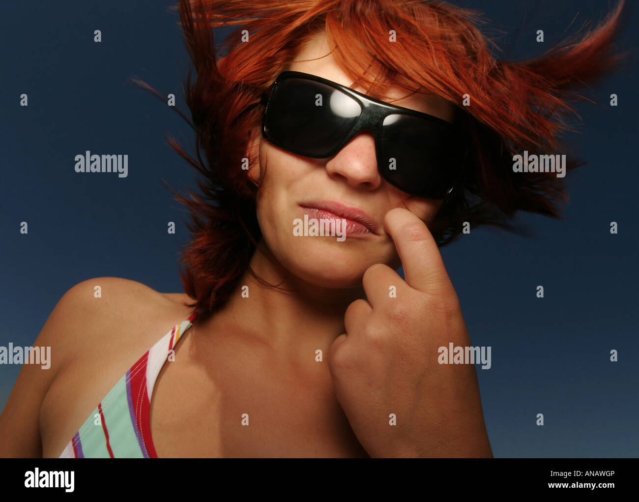 portrait of a young redheaded woman with sunglasses Stock Photo - Alamy
