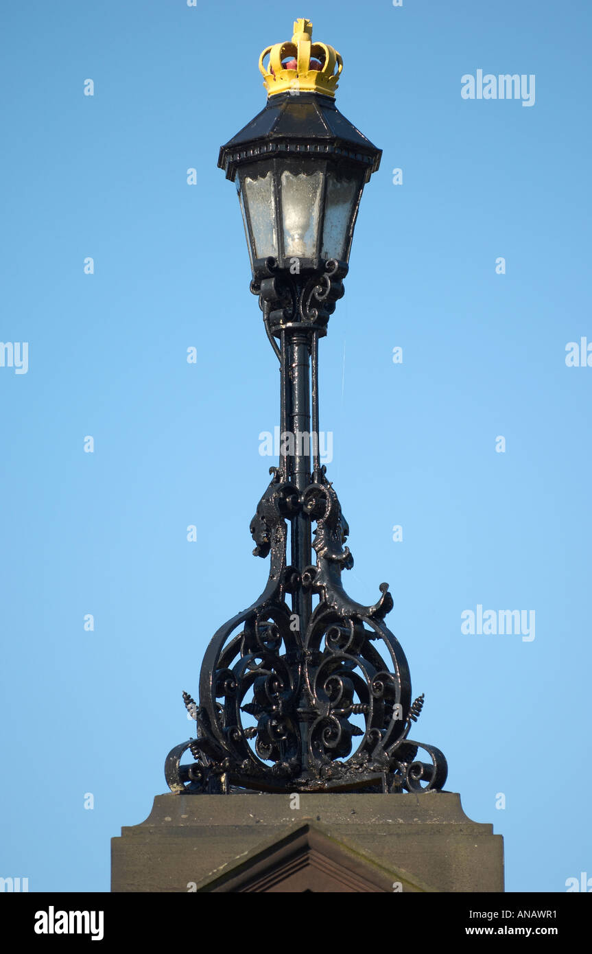 Ornate cast iron lamp post and blue sky Stock Photo