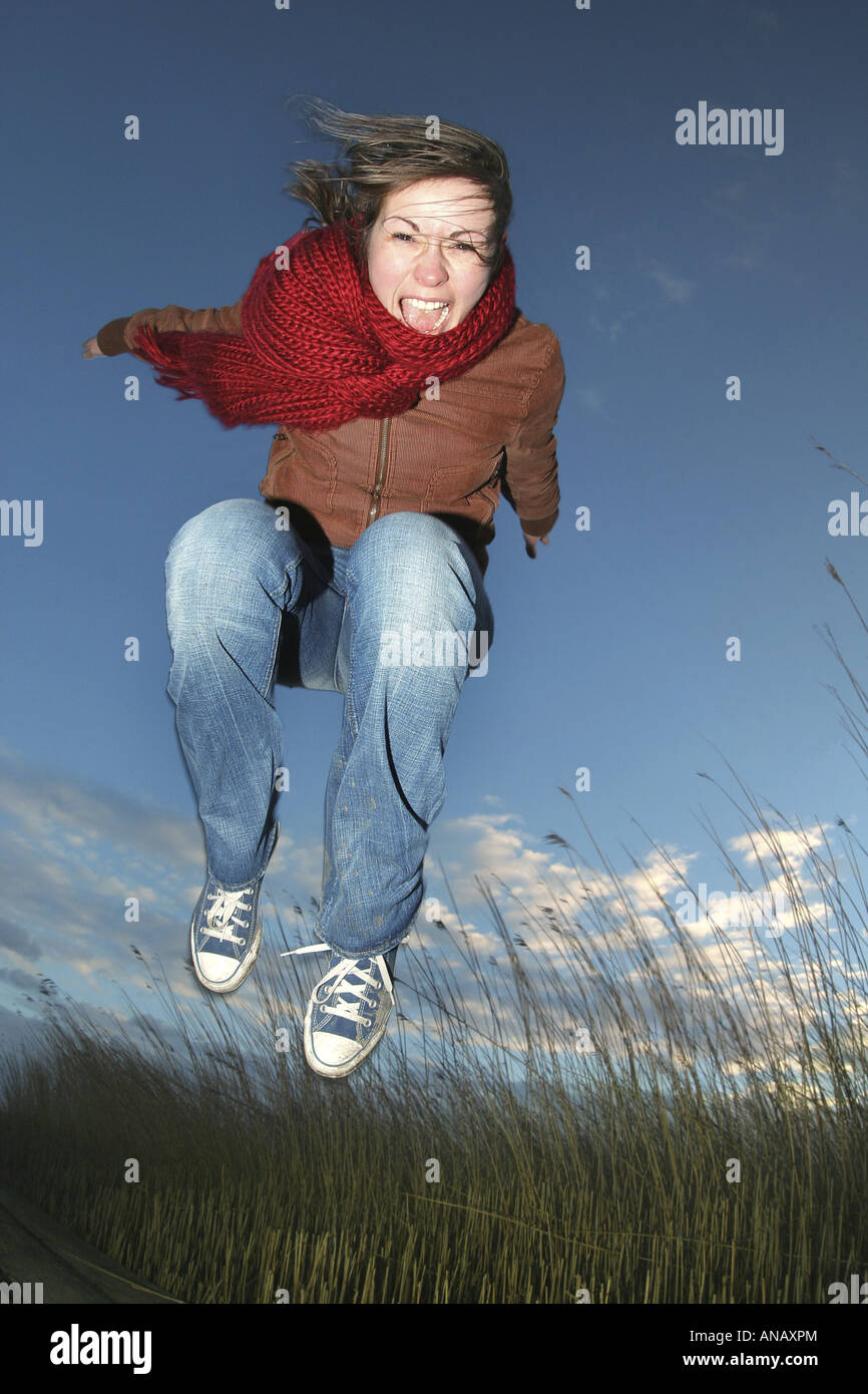 young woman cutting a caper Stock Photo Alamy
