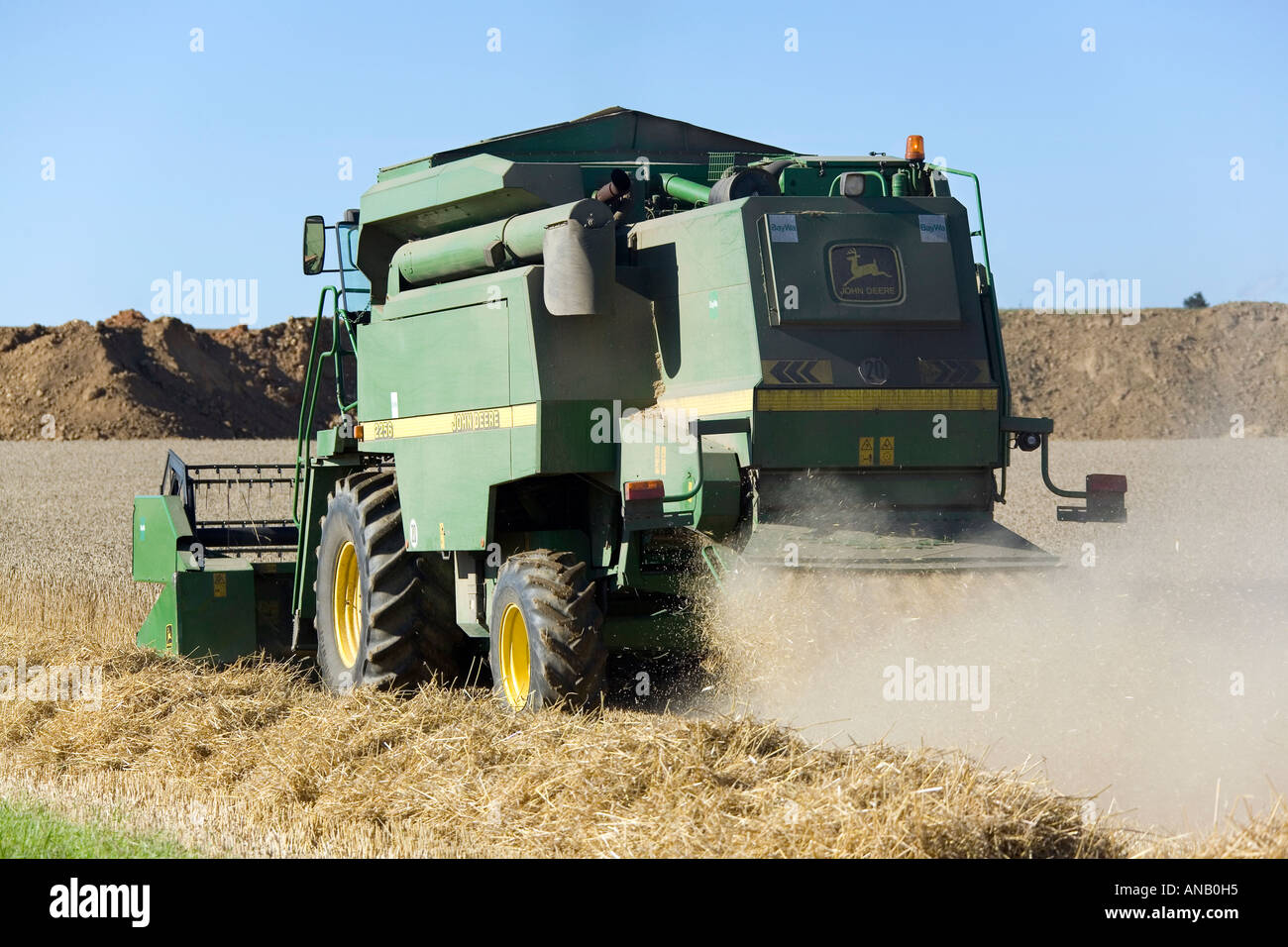 A combine harvester is harvesting wheat Stock Photo