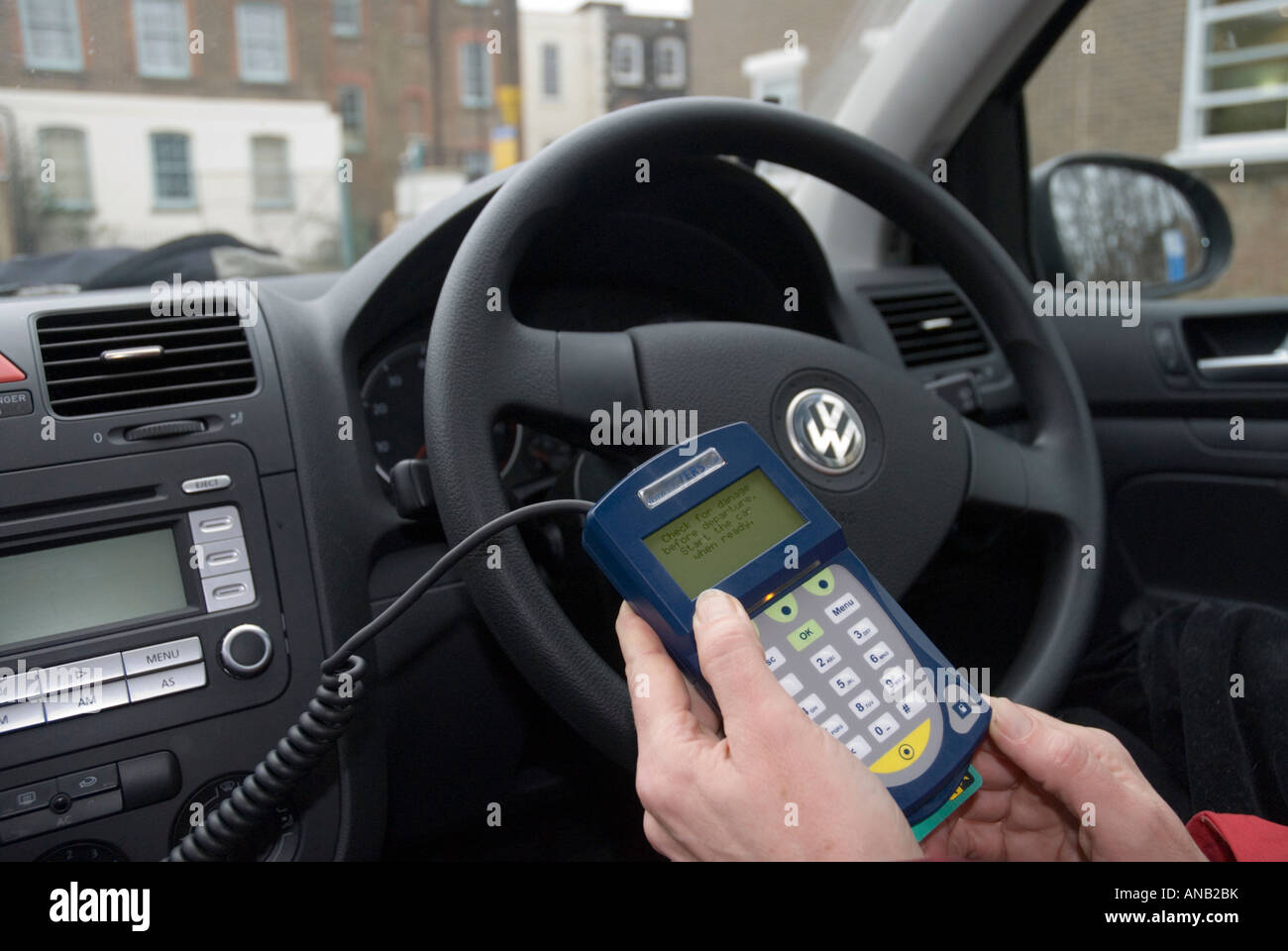 Handheld keypad allowing ignition of shared car Streetcar Stock Photo