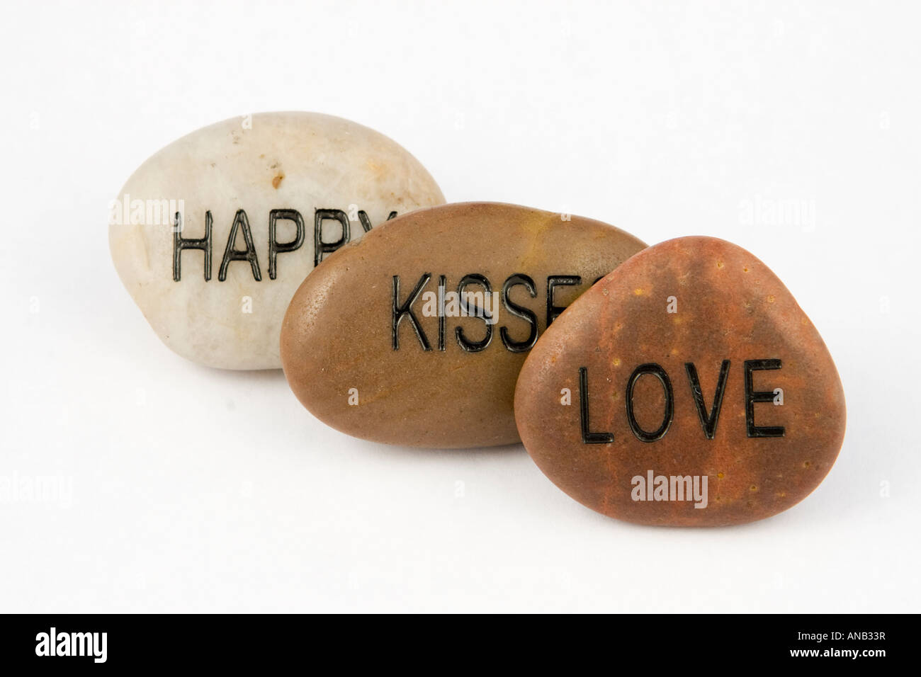 Words on stones Happy, Kisses and Love Stock Photo Alamy