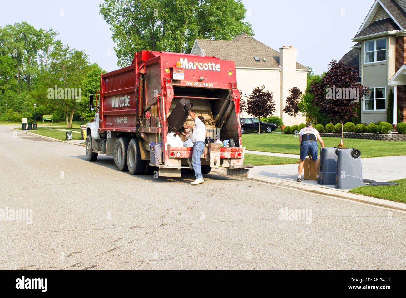 Local Neighborhood rubbish collection workers pick up household trash