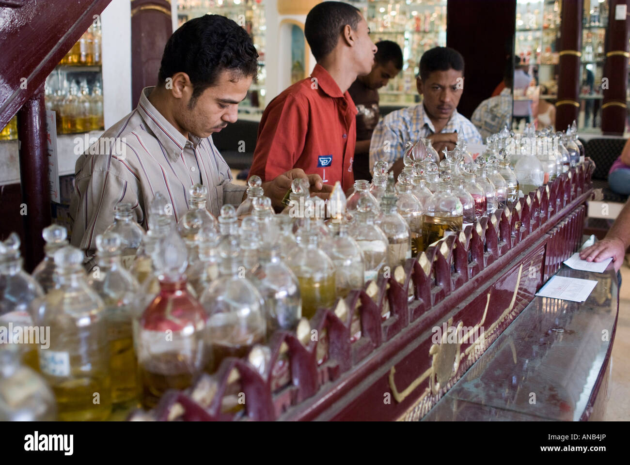 Egypt Luxor selecting essential perfume oils in a glass blowing