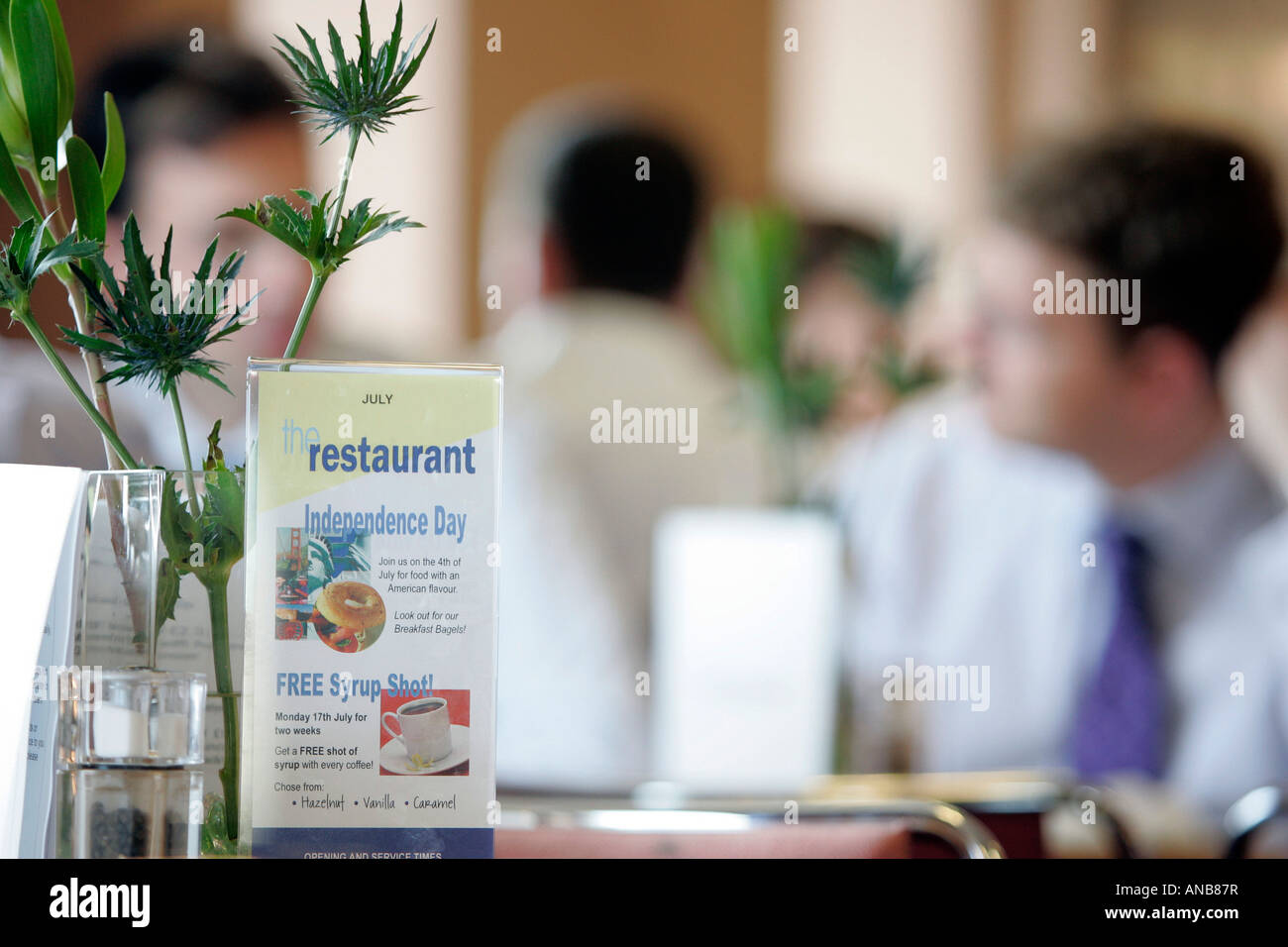 OFFICE WORKERS HAVING LUNCH IN AN OFFICE CANTEEN. Stock Photo