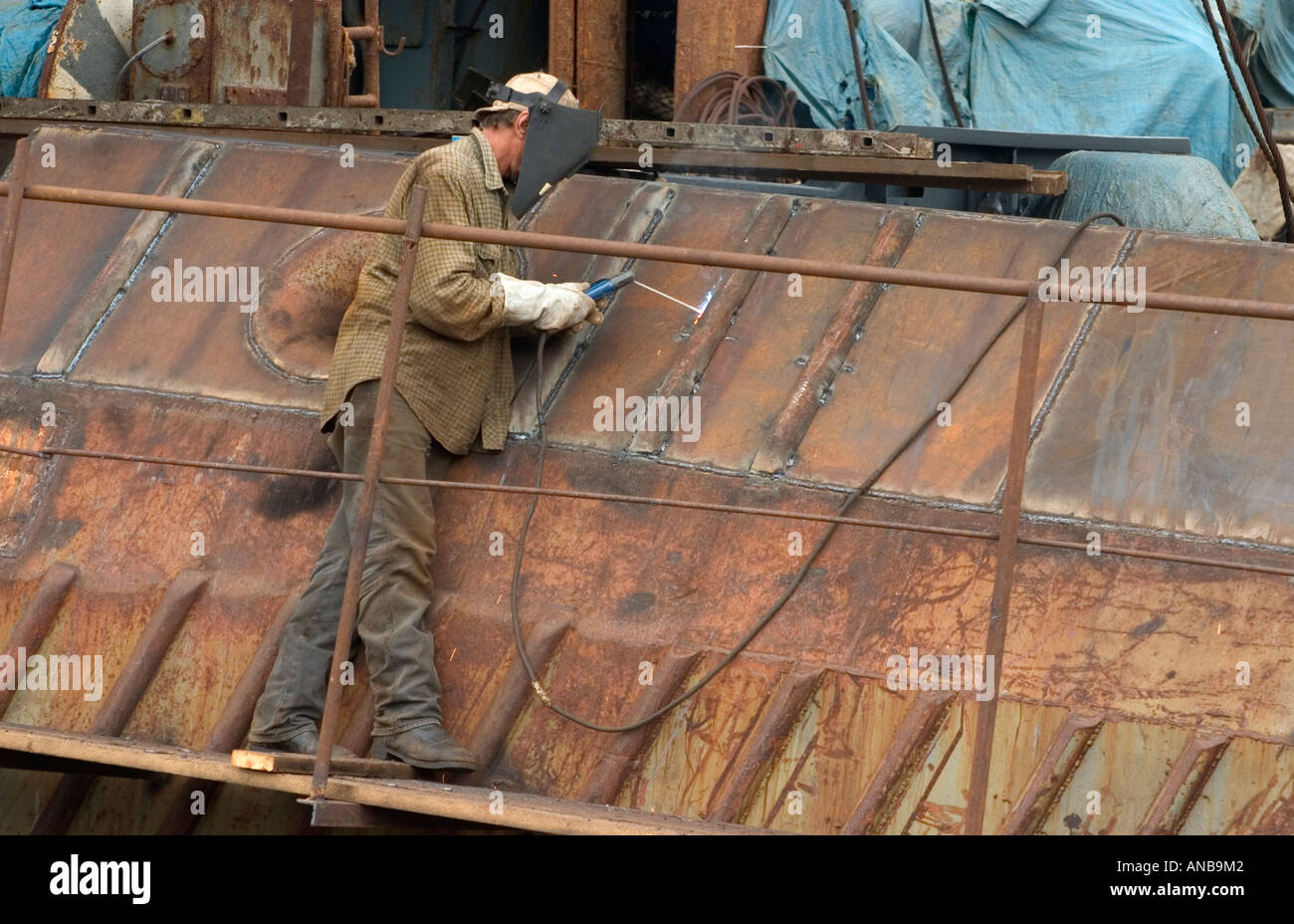 Welding old rusting Russian trawler ship in Las Palmas, Gran Canaria Stock Photo