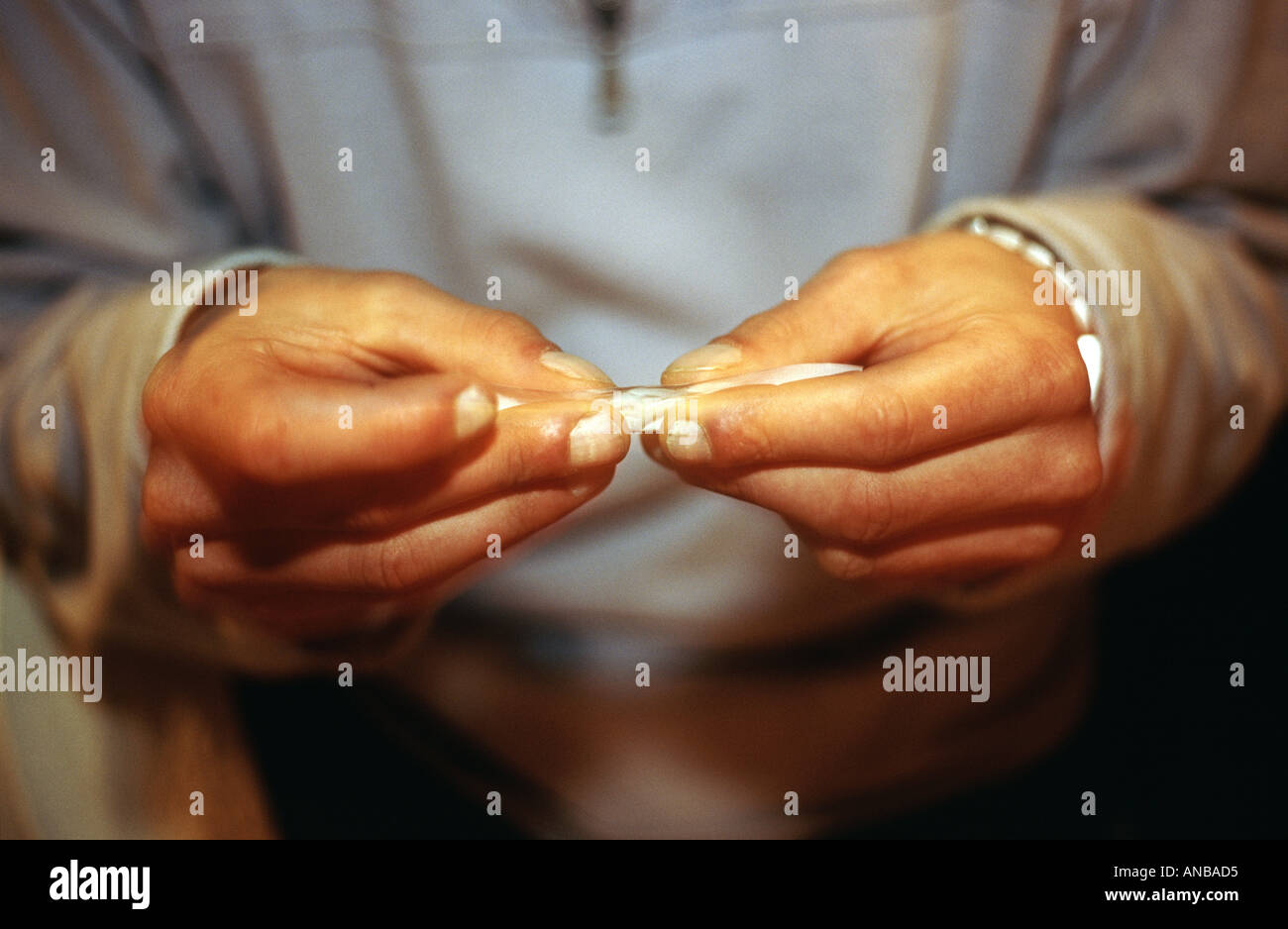 A man rolls a marijuana cigarette Stock Photo