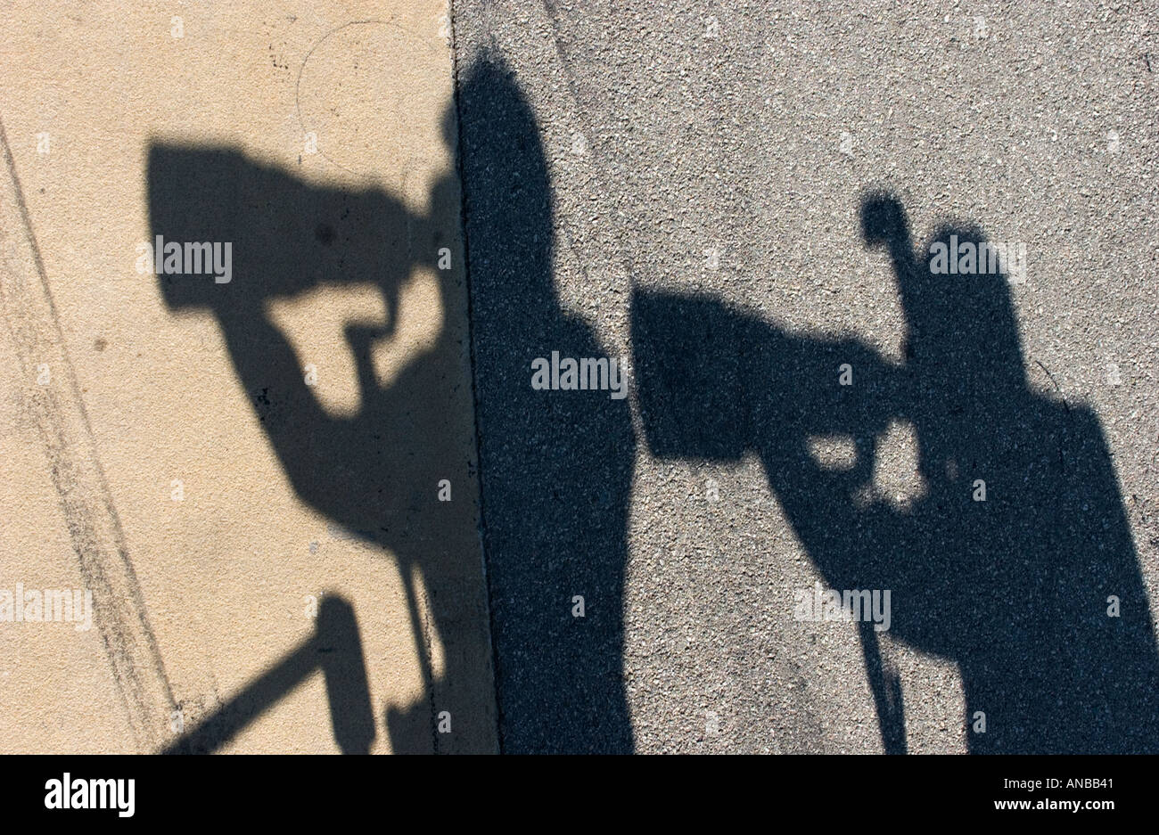 shadows of photographers with long telephoto lenses Stock Photo