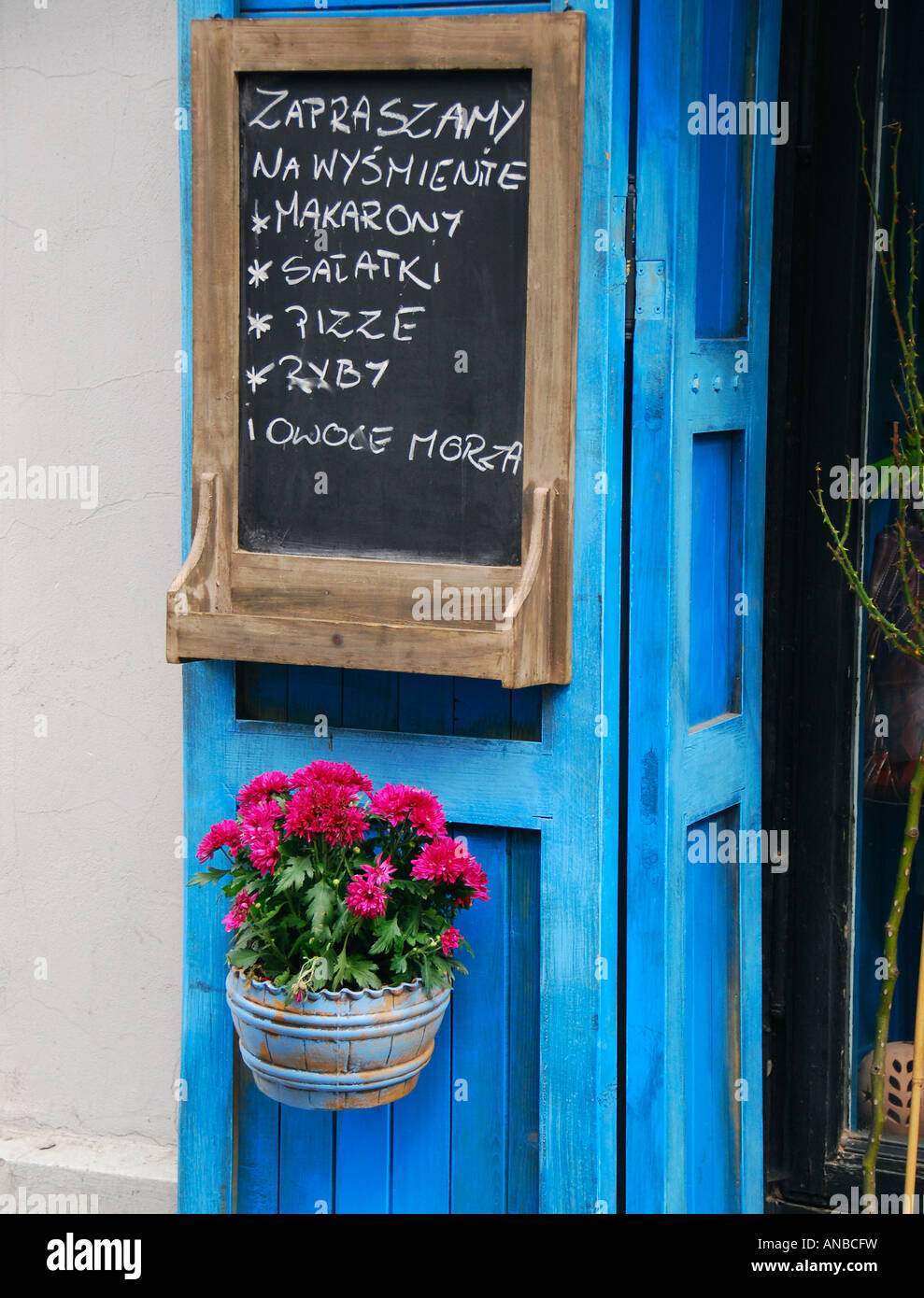 Traditional Polish Cafe Menu With Blue Door And Red Flowers Stock