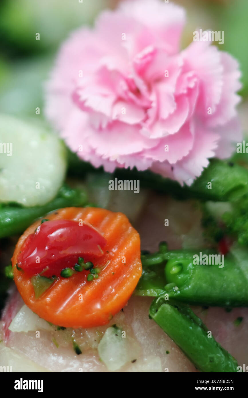Fish with carnation, carrots and other vegetables Stock Photo Alamy