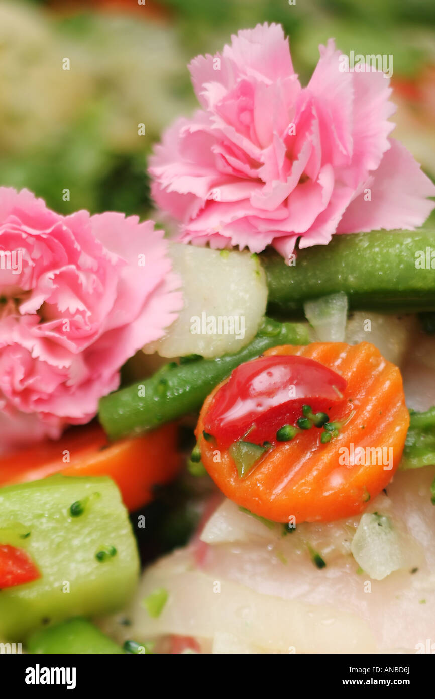 Fish with carnations, carrots and other vegetables Stock Photo Alamy