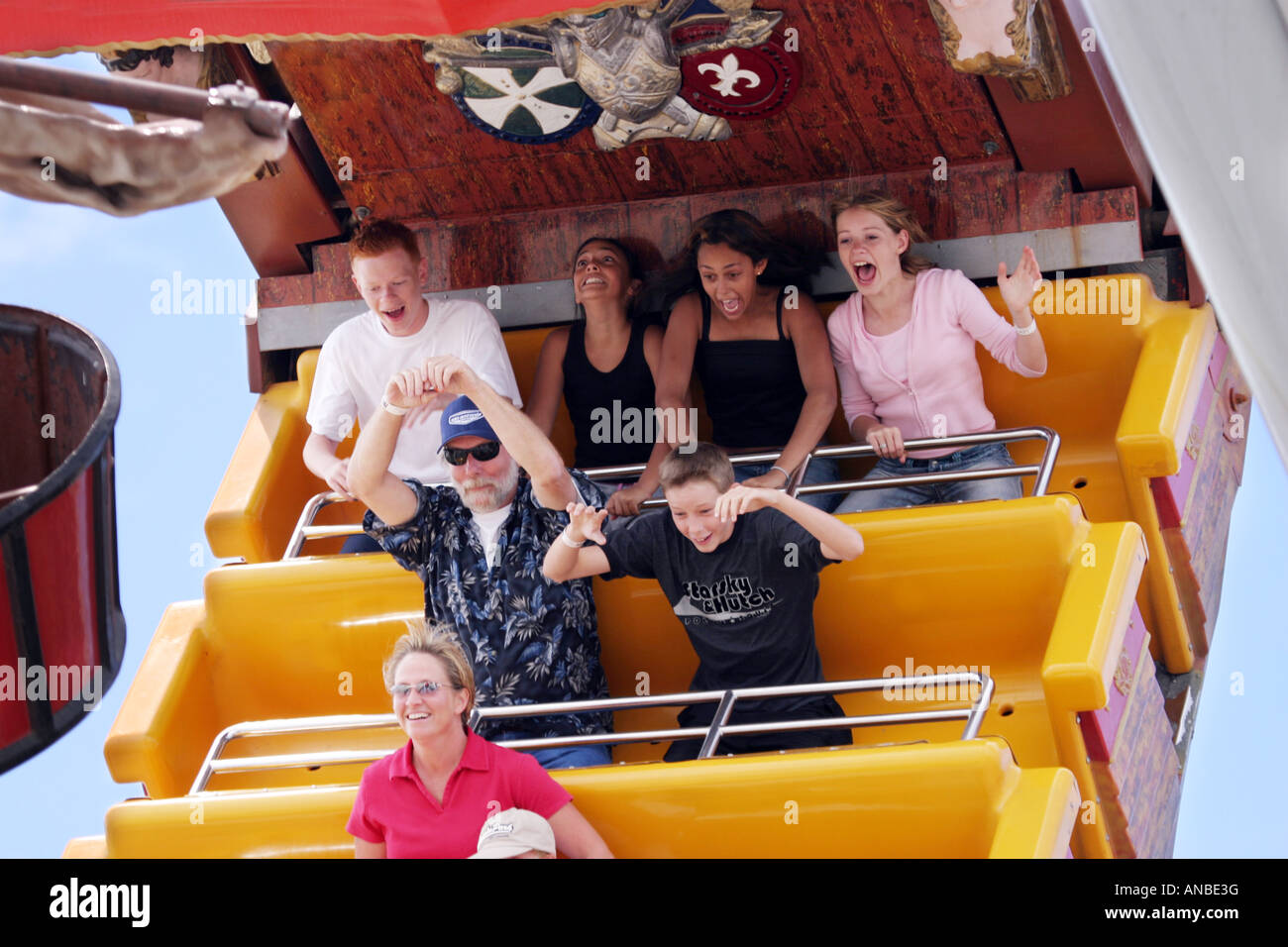 Children enjoying the Pirate ship swing ride, The Boardwalk funfair, Santa Cruz, California USA Stock Photo