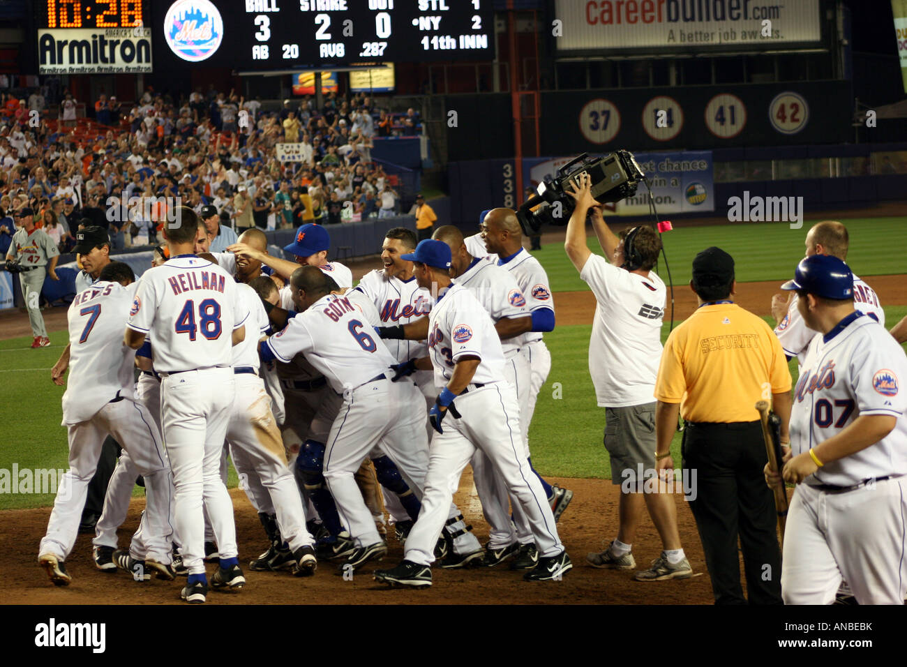 The New York Mets mob teammate Shawn Green after his extra-inning game winning home run at Shea Stadium on June 25, 2007 Stock Photo