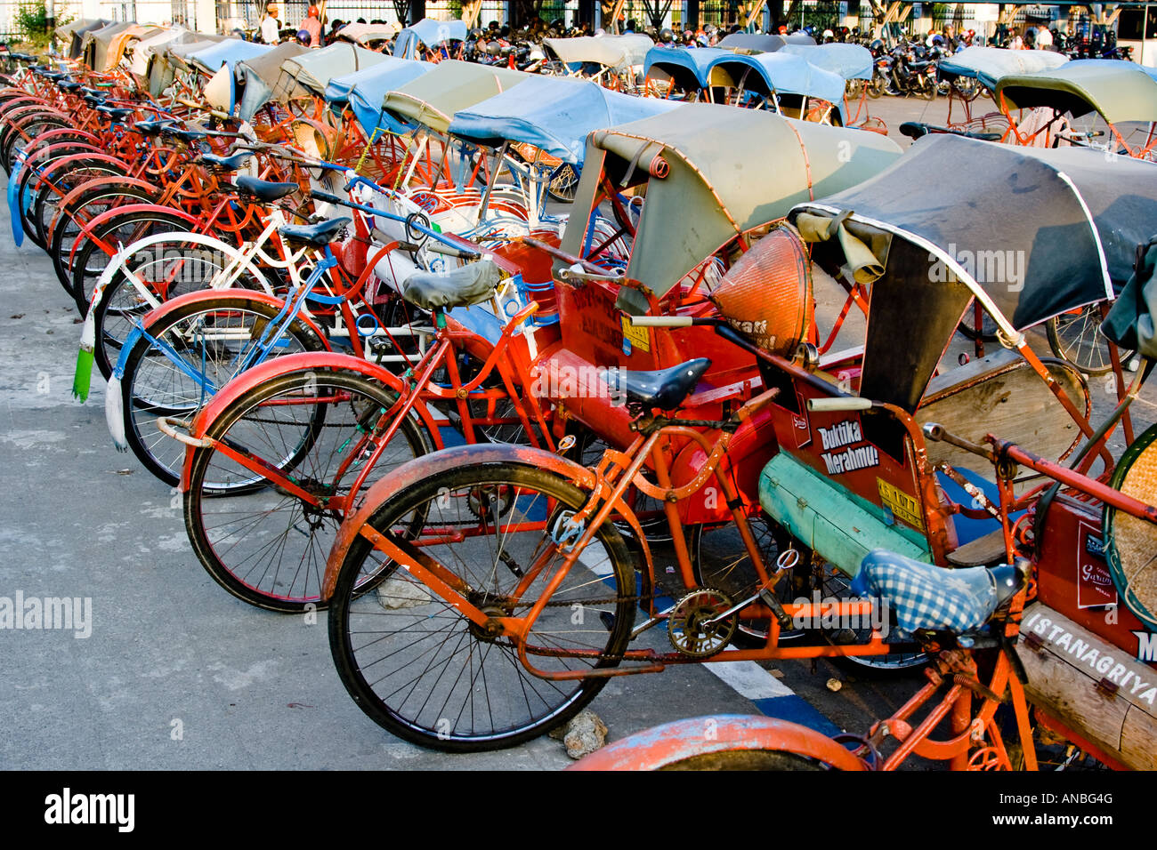 Row of Becak Trishaw Bicycle Taxis Solo Java Indonesia Stock Photo