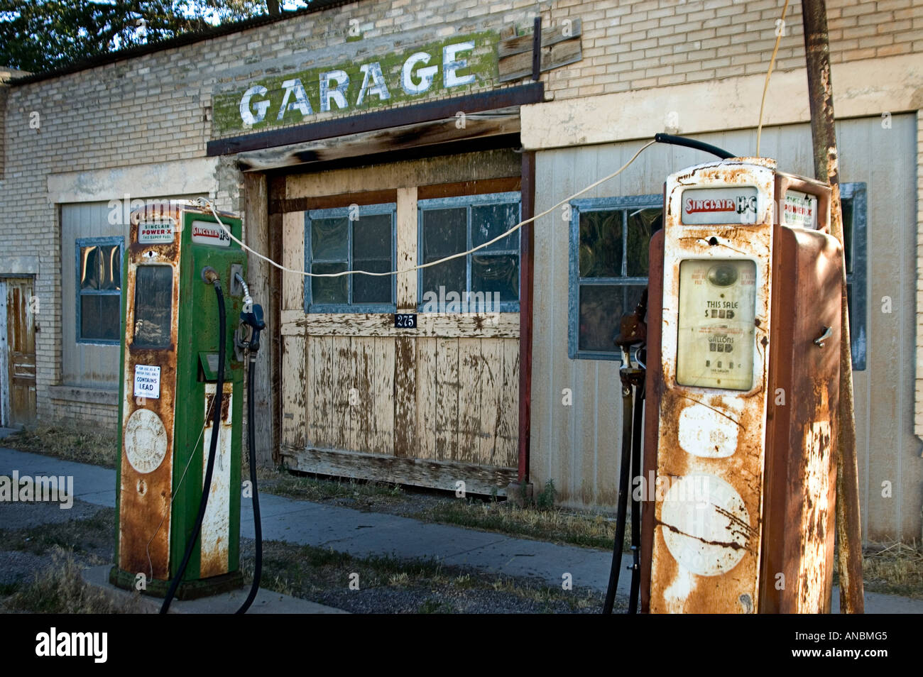 Old abandoned gas station with gas pump out front Stock Photo 8843780