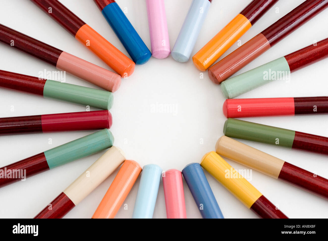 Coloured Pencils arranged in a circular pattern Stock Photo