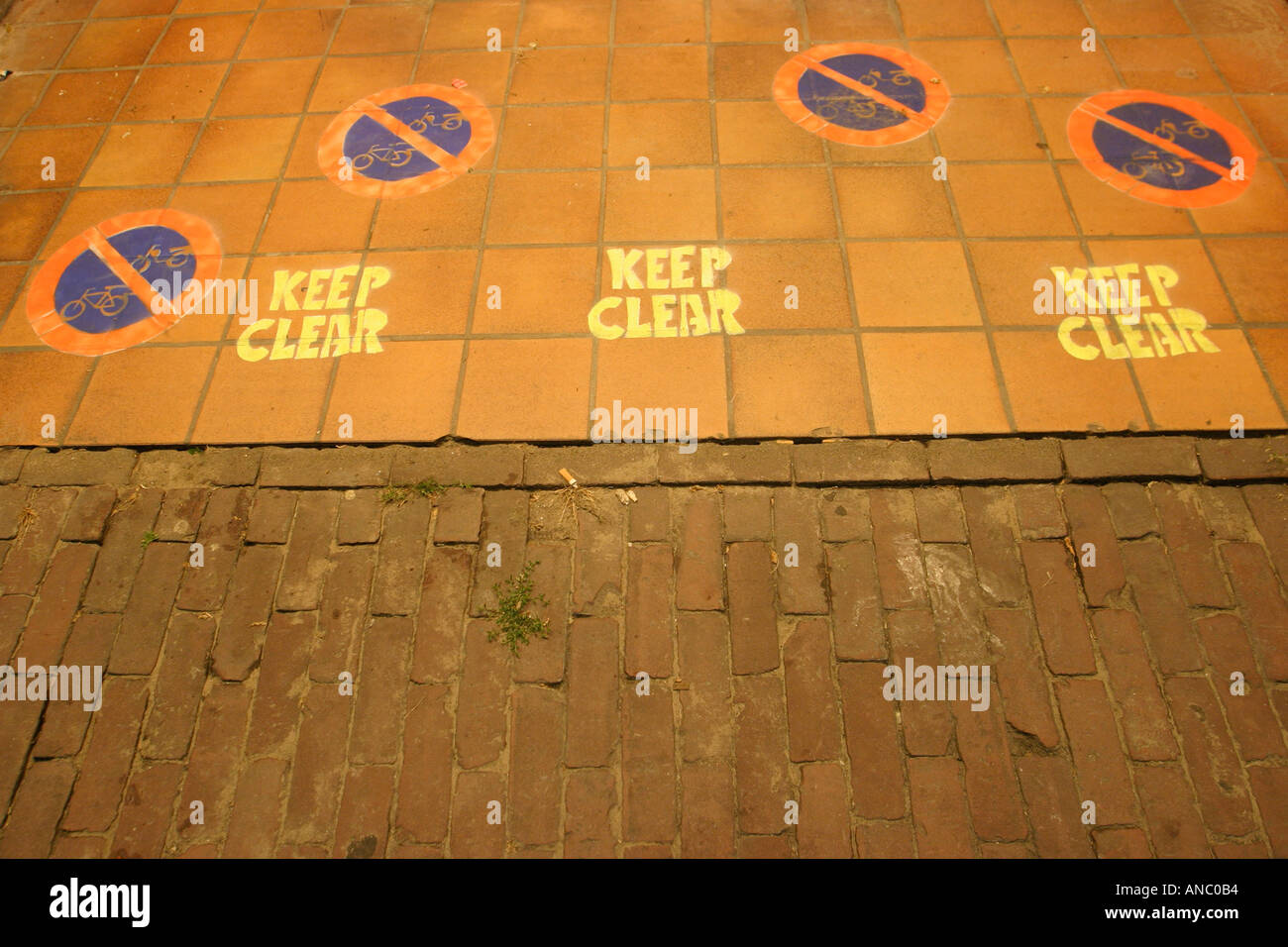 Traffic signs Keep Clear on footpath Stock Photo - Alamy
