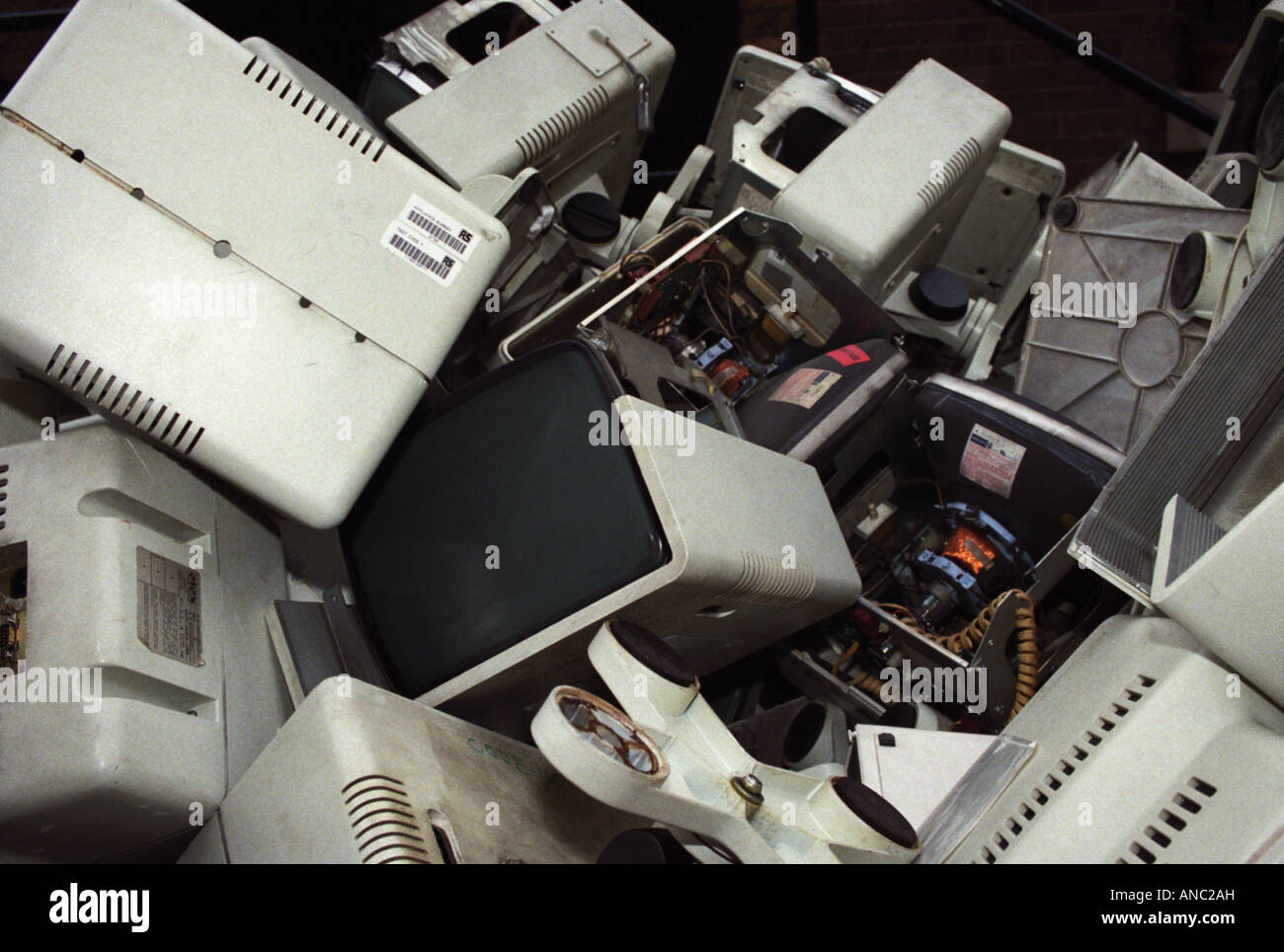 computers redundant rubbish technology outdated trash in dump skip Stock Photo