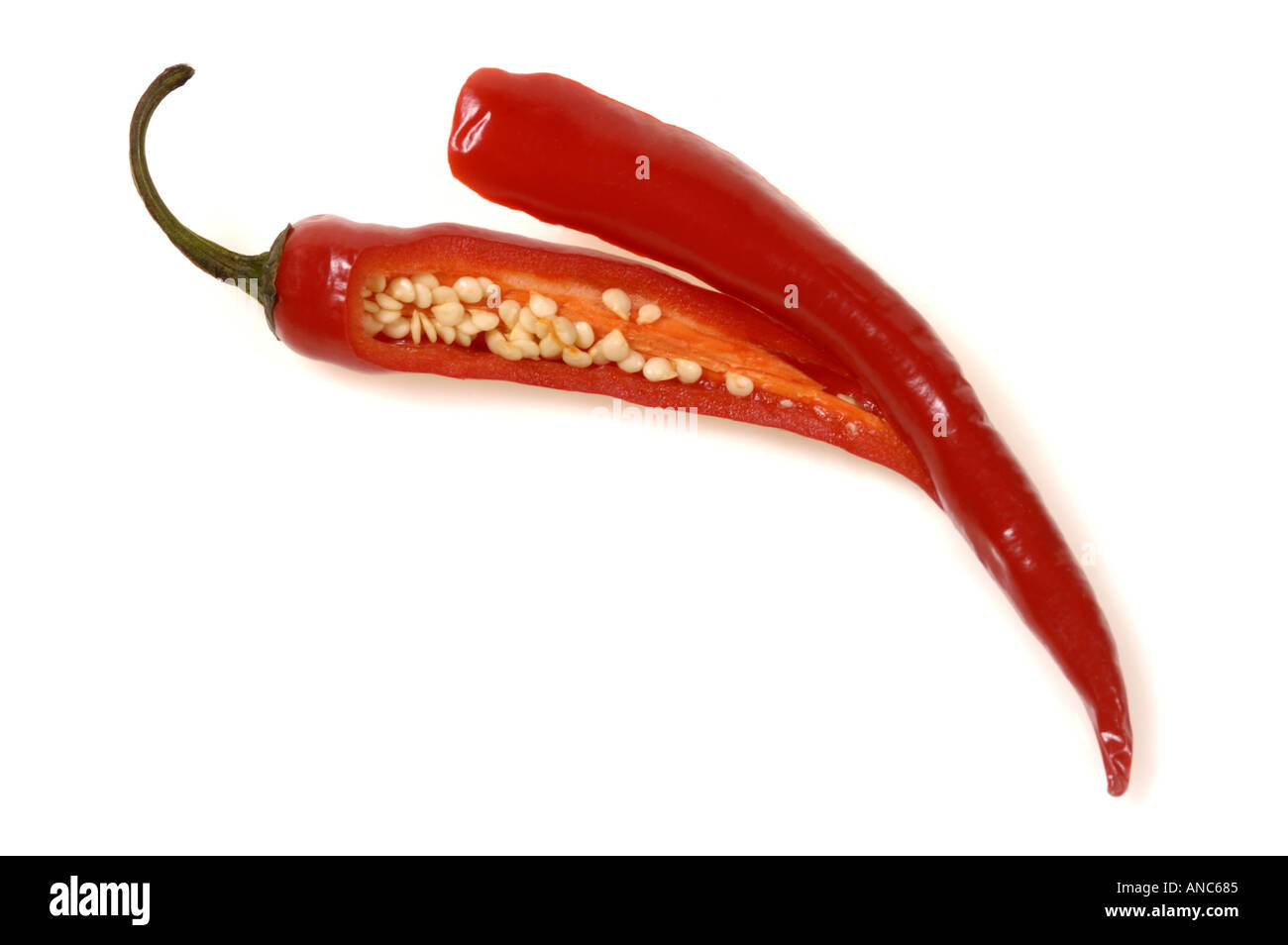 1 one fresh red pepper chilli chilly chile chili FOOD single cut off seed inside corn schote Stock Photo
