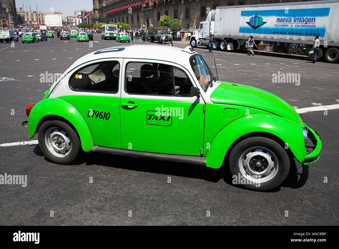 Bright green Volkswagen Beetle taxi in Mexico City Stock Photo