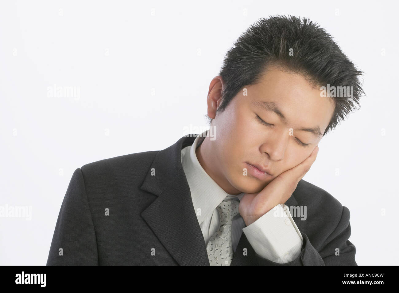 Asian businessman sleeping Stock Photo - Alamy