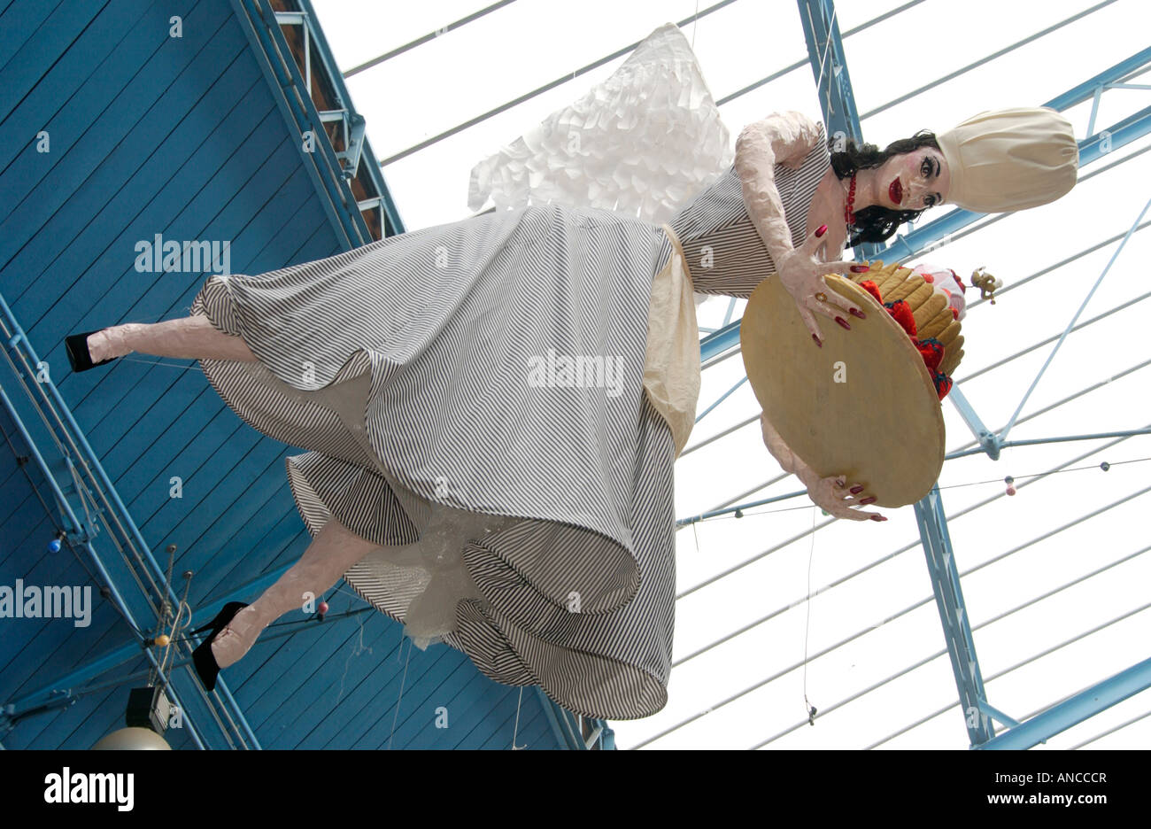 Chef sculpture hanging from roof of Market Hall during Abergavenny Food Festival South Wales UK EU in style of Nigella Lawson Stock Photo
