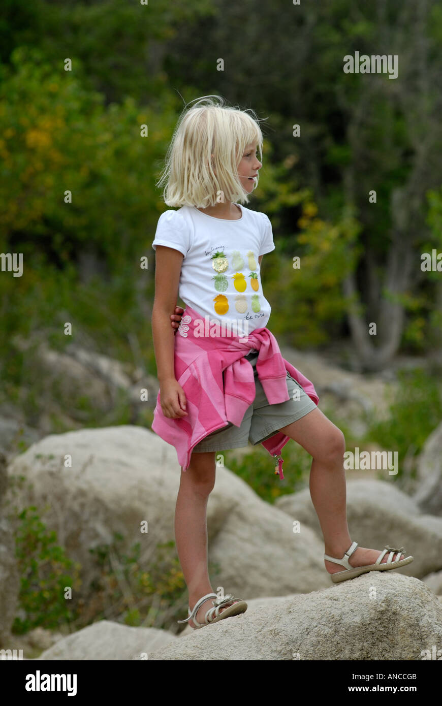 tiny models girls Small blonde girl in a white and pink top stands on a rock Stock Photo -  Alamy