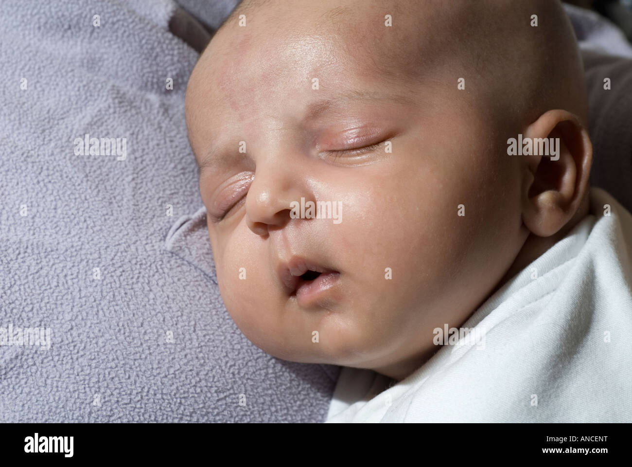 newborn baby boy sleeping on mother chest Stock Photo