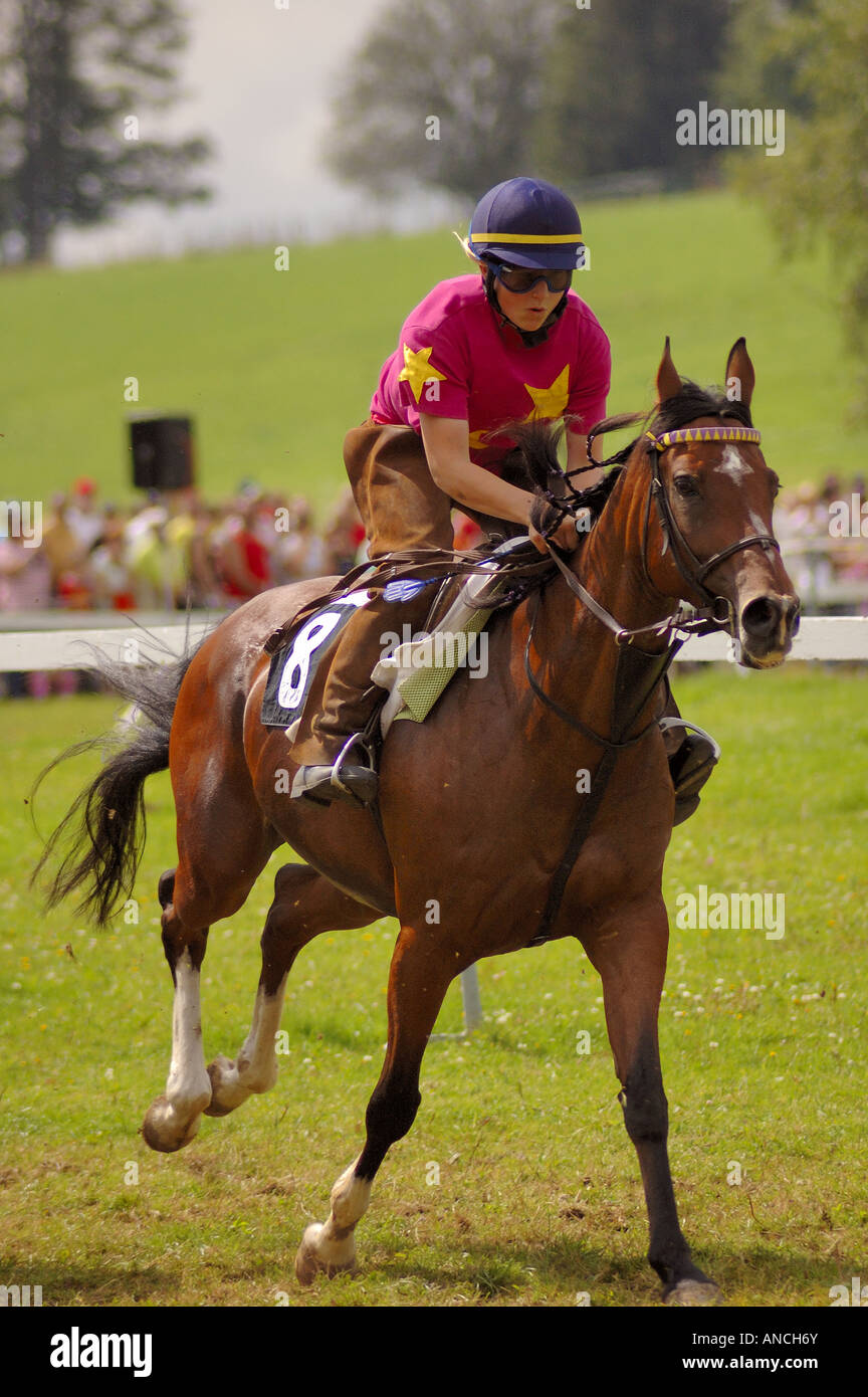 A horse rider flat out in a race at the Saignelegier horse fair Stock Photo