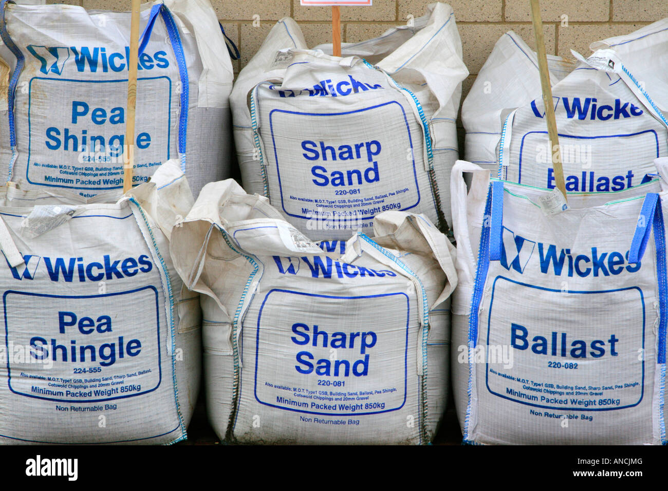wickes sharp sand building materials in bags outside store england uk