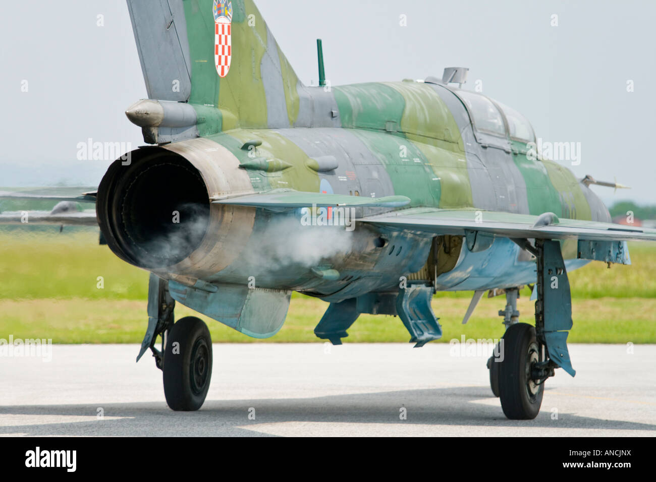 Croatian Air Force MiG-21 UMD taxiing and trailing smoke from engine, Pleso AFB during 'open day' visit in 2007 Stock Photo