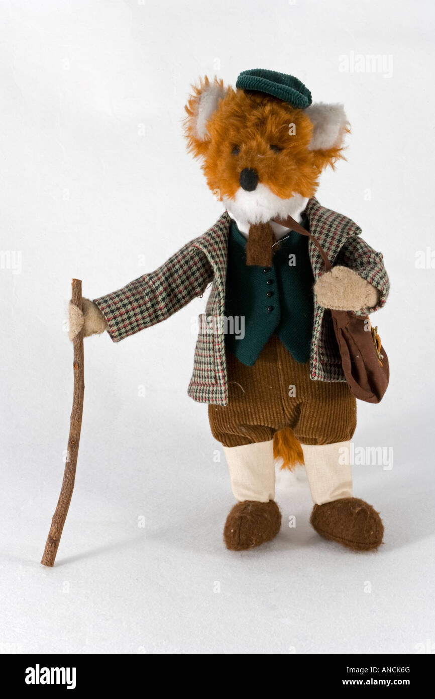 Hand made fox soft toy standing with check coat plus fours hat and stick UK Stock Photo
