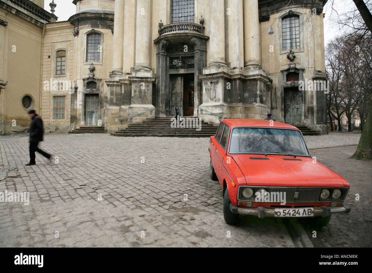 Red Lada outside the Dominican Church of the Assumption, Lviv, Ukraine. Stock Photo