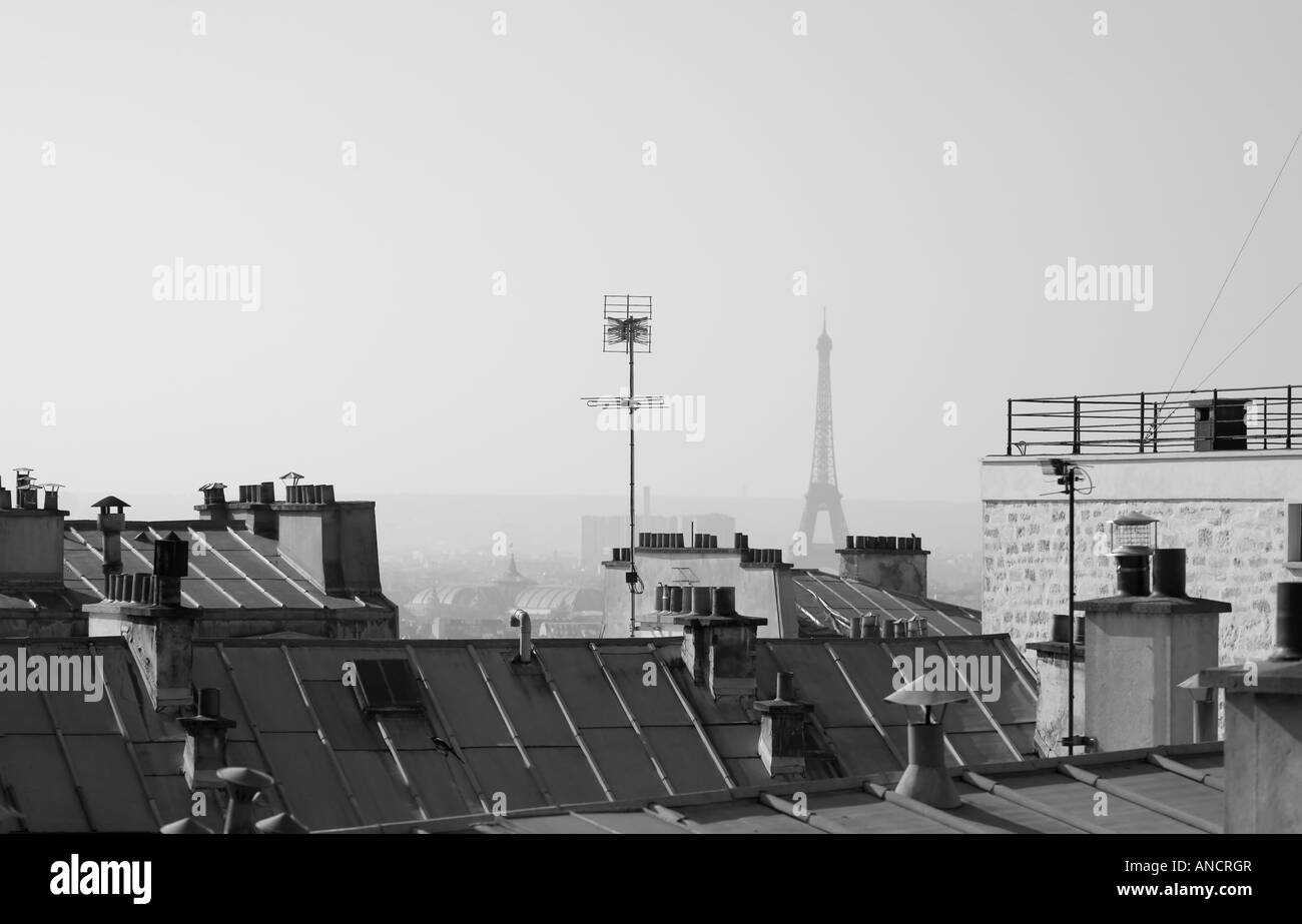 View of the Eiffel Tower over Paris rooftops. Stock Photo