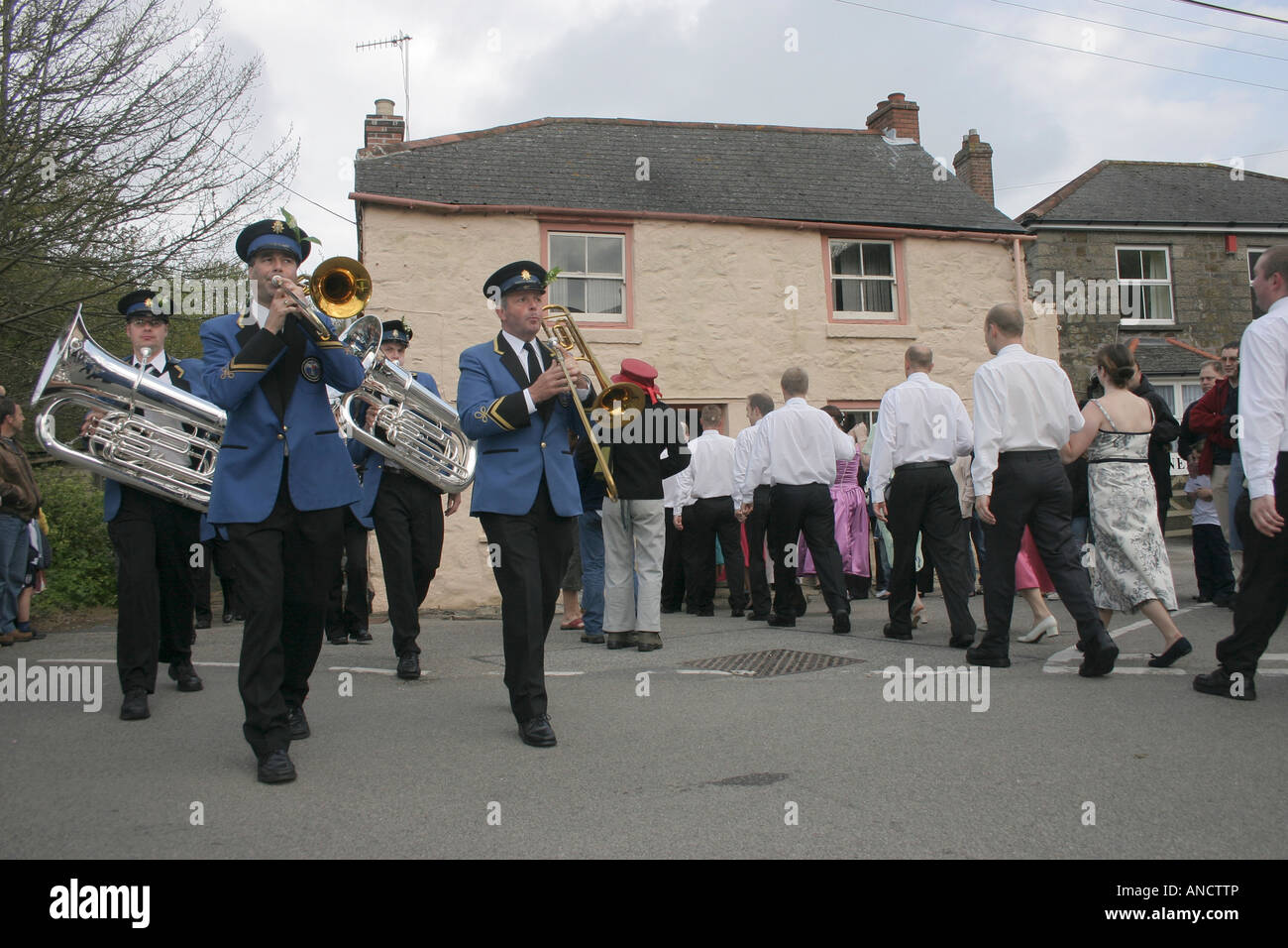 The Helston Town Band leads the annual procession in and out the houses during Helston's Mayday Furry Dance. Stock Photo