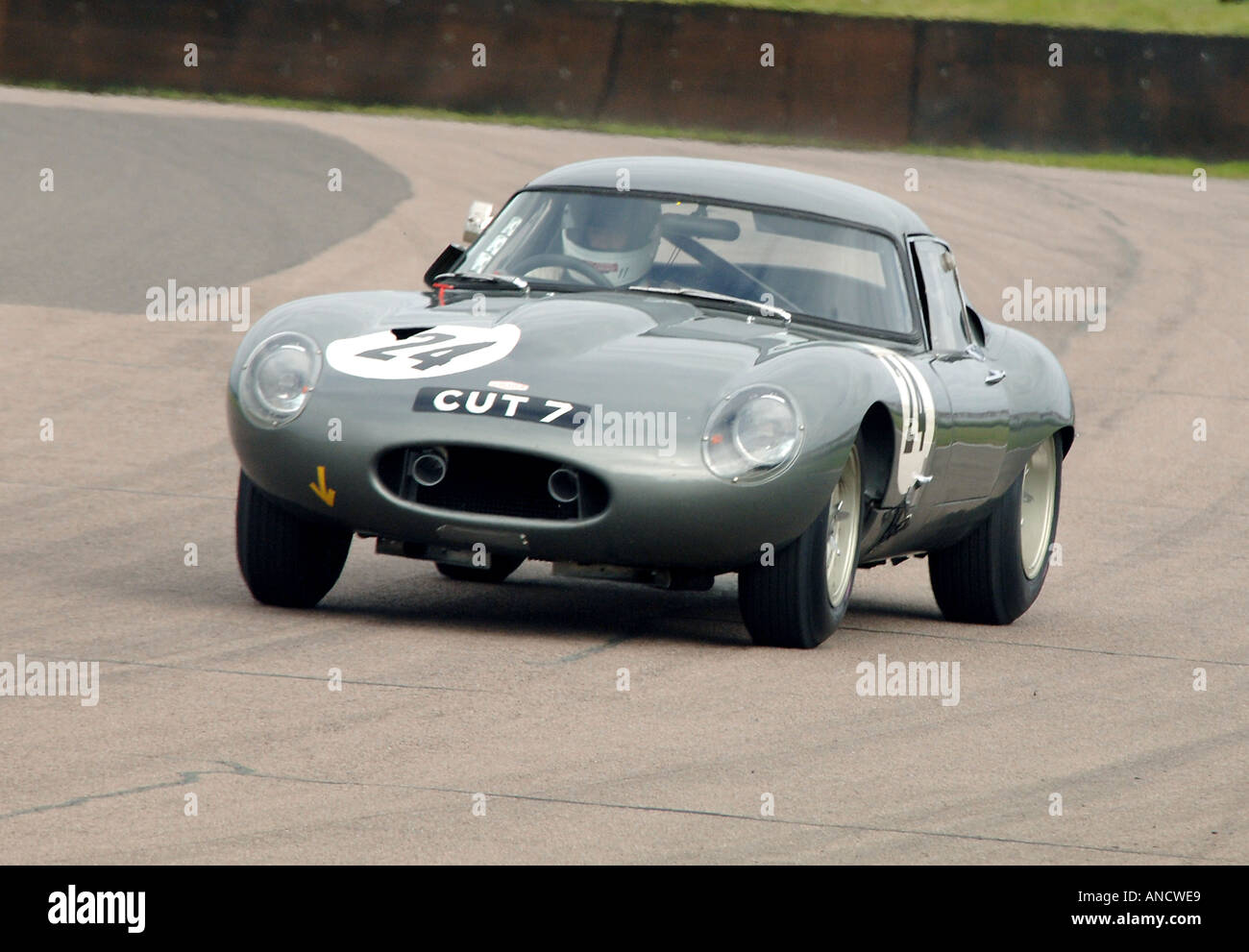 famous racer Jaguar E Type lightweight CUT 7 Classic GT car racing at the 2005 Goodwood Revival Stock Photo